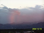[Sunset makes a rainbow up in the mountains (it was clearly raining up there)]