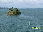 [Small island in Lake Gatun [inundated mountain-top]; stay on the correct side of the bouy!]