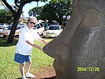 [Sandi tweaks the nose on a Polynesian statue (Honolulu)]