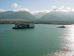 [Tug and Barge Now Towing, with Beautiful Iao Valley in Background
]