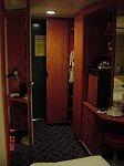 [Looking Towards Cabin Door with Closet on Right, Bath/Shower on Left [tall reflection on left is a vertical mirror showing cabin areas off to the right]
]